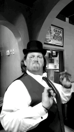 Derek dancing in a bowler hat